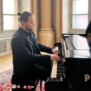 Pianist Vladyslav Panchenko playing the piano. 